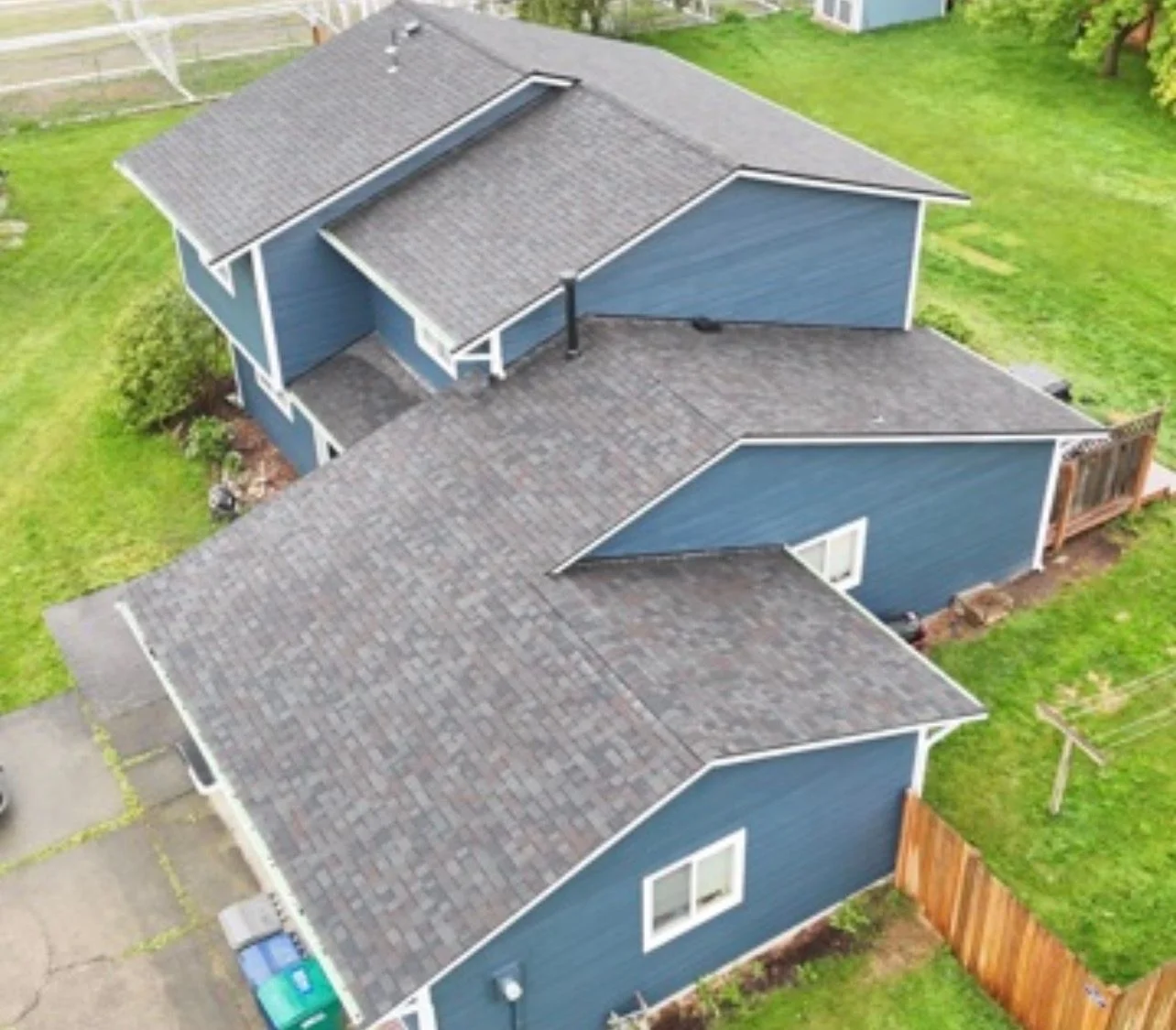 Roofing contractor installing new roof on residential home